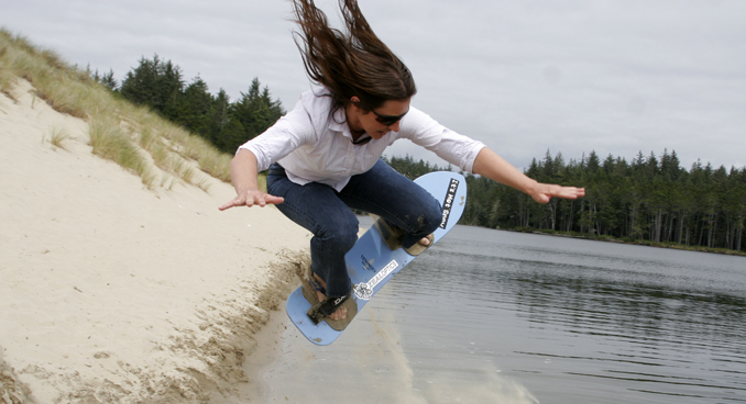 Sanboarding is a popular activity at the Oregon Dunes. Courtesy Eugene, Cascades and Coast