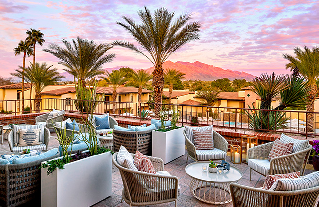 Witness nature's masterpiece as the sun bids a stunning farewell over the picturesque grounds of Omni Tucson National Resort, painting the sky with vibrant hues of the desert sunset.